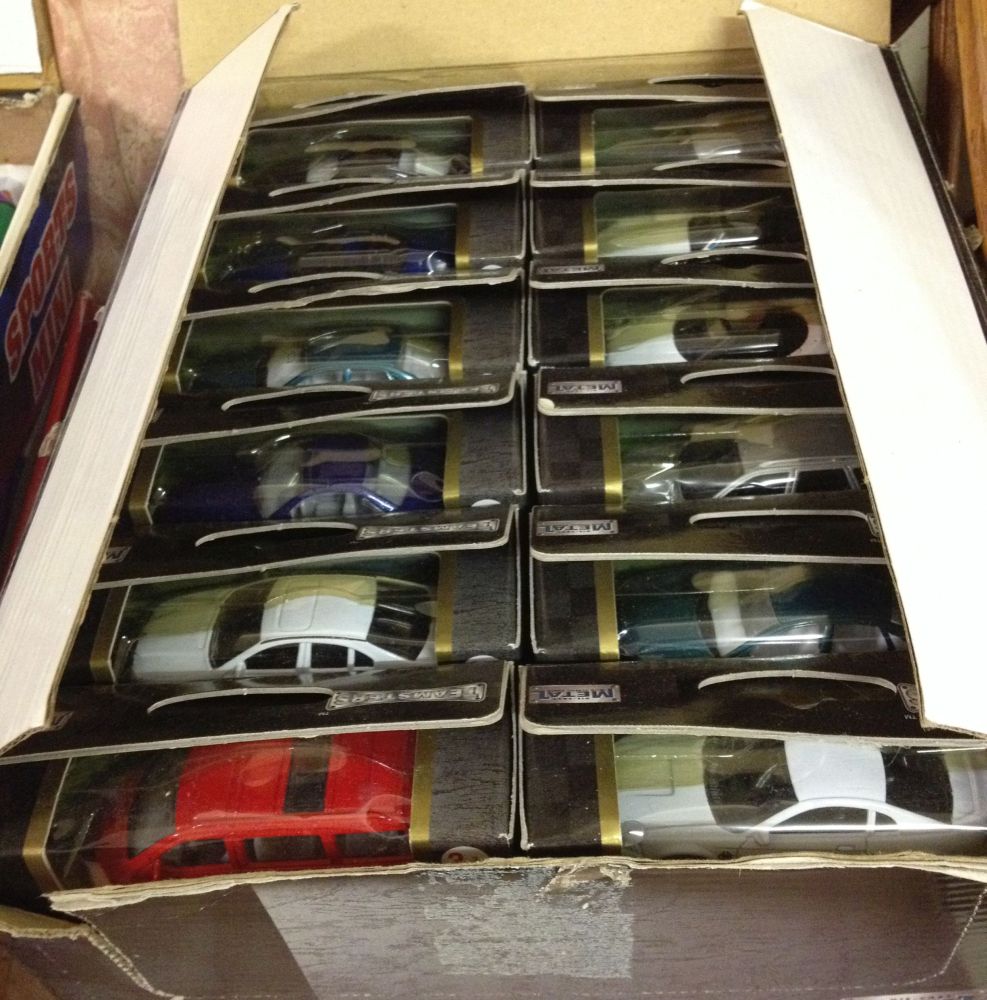 A trade box of 36 1:60 scale Teamsters diecast cars.