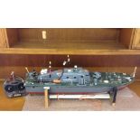 A large radio controlled motor torpedo boat & controller. Boat approx 32 inches (82cm) long.