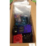 A box of 4 Nintendo Game Boy Colour & Advance handheld consoles and chargers with 12 Game Boy