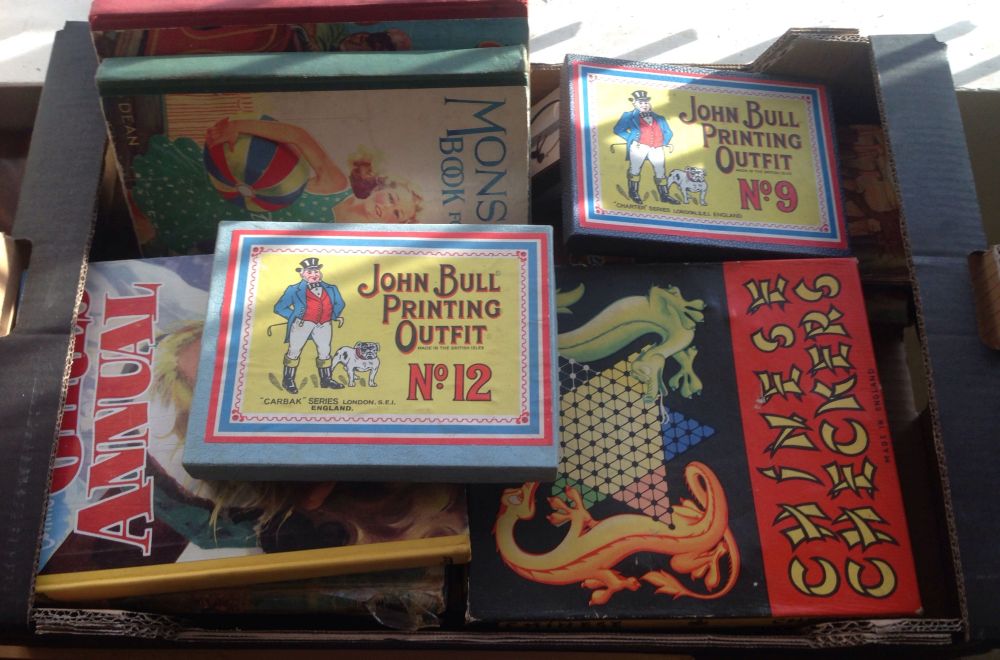 A box containing 1940/50s girls annuals and story books. Together with 2 John Bull printing kits,