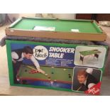 A boxed Steve Davis 'Pot Black' junior snooker table. 54" x 27«" x 28".