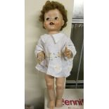A c1950s 22" plastic doll, unmarked - probably english, with sleepy eyes and teeth. Walking action