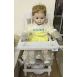 A Danbury mint doll 'Sitting Pretty' complete in white wooden high chair. In original box with