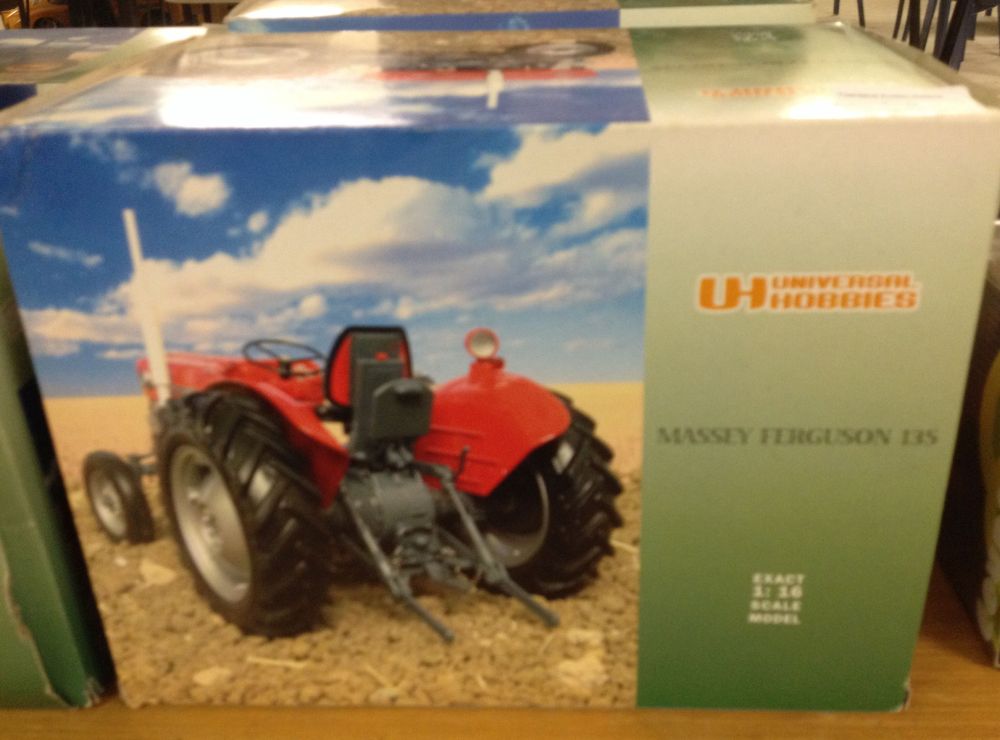 A boxed Universal Hobbies 1:16 scale Massey Ferguson 135 tractor #UH2698U.