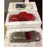 3 boxed Danbury Mint 1:24 scale cars: 1) 1949 jaguar XK120. 2) 1940 Ford Deluxe Coupe and 3) 1966