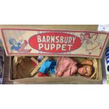 A boxed Barnsbury puppet chimpanzee.