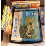 Blue Peter memorabilia including jigsaws and books. To include No.1 annual and unusual Bleep and