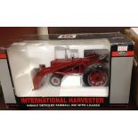 A SpecCast International Harvestor McCormick Farmall 300 tractor with loader. 1/16th scale, in box