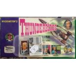 A collection of 1960s Thunderbirds items - 1) A Waddington's Thunderbirds board game. 2) A set of 50