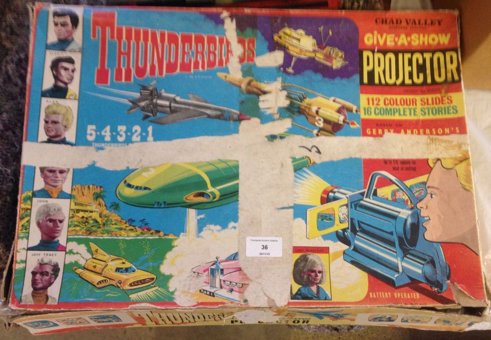 A c1960s Chad Valley Thunderbirds Give-a-Show projector & slides.