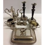 A box of silver plated wares to include a large pair of candlesticks