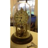 A 400 day anniversary clock by Schatz of Germany. Under a glass dome, believed to be in working