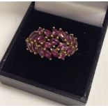 Very pretty 9ct gold ladies dress ring set with approx 22 pink tourmaline stones.  Size P, total
