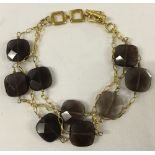 A designer Tateossian London smokey quartz gold plated silver costume jewellery 3 string bracelet.