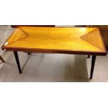 A c1970s wooden coffee table.