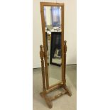 A pine cheval mirror with barley twist uprights