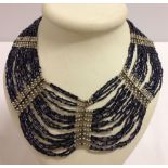 Costume jewellery collar necklace of midnight blue & silver beads by Adini.