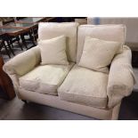 A John Lewis 'Derwent' cream 2 seater sofa.