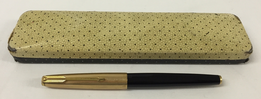 A Parker 61 capillary action fountain pen in black with gold cap.