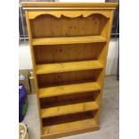 A pine bookcase - 4 shelves. 76cm wide & 151cm tall.