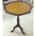 Piecrust mahogany wine table with leather top.