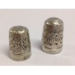 2 vintage engraved white metal thimbles.