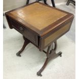 Dropside mahogany leather top occasional table with casters.