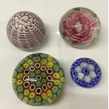 4 glass paperweights including millefiori. ( small blue paperweight a/f)