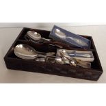 A vintage carved wood cutlery tray containing a large quantity of silver plated cutlery, together