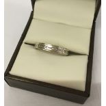 9ct gold and silver full eternity ring set with white stones, size Q.