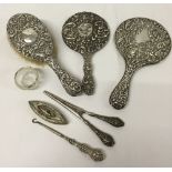 7 antique silver items comprising 2 mirrors, button hook, glove stretcher, nail buffer, hair