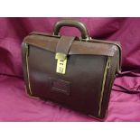 A large brown doctors/nurses briefcase.