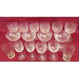 16 Edwardian glasses all with matching engraved decoration. Includes 4 champagne saucers.