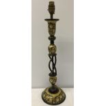 A black laquer table lamp with gold & cream decoration.