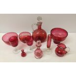 10 pieces of cranberry glass to include decanter and scent bottle