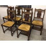 6 solid oak traditional Breton rush seated chairs with wheel design to backs.