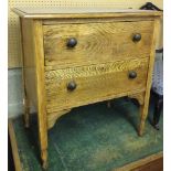 A light oak 2 drawer chest of drawers with octagonal carved feet. 71cm wide.