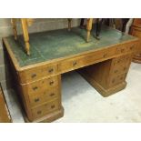 A vintage pedestal desk with green leather top. Comes in 3 parts being two 3 drawer pedestals and