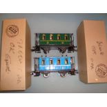 An ETS O Gauge pair of tinplate coaches, comprising a third class in green and a second class in