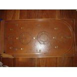 A Chad Valley Bagatelle game circa 1950s/60s complete with marbles.  One or two pins missing.