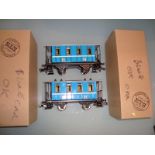 An ETS O Gauge pair of tinplate coaches, comprising two second class in blue.  VG-E in G boxes. (2)