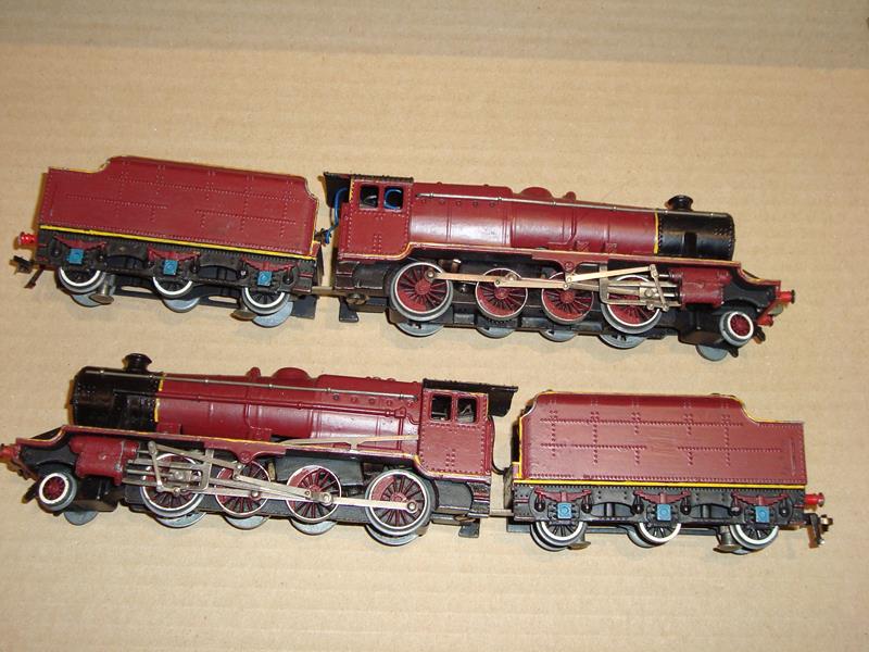 A pair of Hornby Dublo 3 rail class 8F locos both repainted in maroon livery.  F (2)