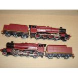 A pair of Hornby Dublo 3 rail class 8F locos both repainted in maroon livery.  F (2)