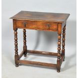 An early 18c oak side table of rectangular form with moulded edge, having one long frieze drawer and