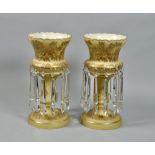 A pair of Czechoslovakian opaque yellow overlaid table lustres with heavy gilt foliate decoration