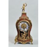 A late 19c French mantle clock in waisted red boullework case with gilt brass feet and mounts,