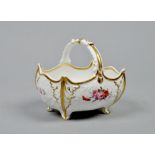 A 19c porcelain basket of lobed rectangular form with shell moulded and gilt highlighted corners.