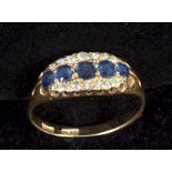 An 18c gold diamond and five stone sapphire set ring.