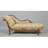 A mid Victorian mahogany framed chaise longue with serpentine three quarter back panel, having a