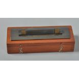 An Edwardian Stanley parallel straight edge with rollers, in mahogany box, 7"w.